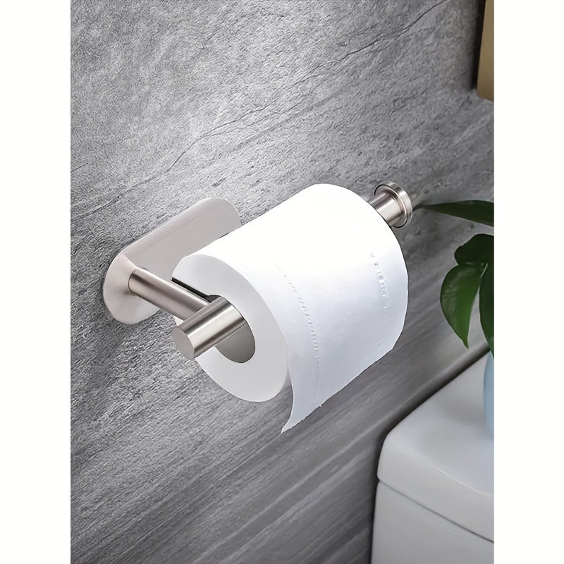 Stainless steel self-adhesive toilet paper holder.