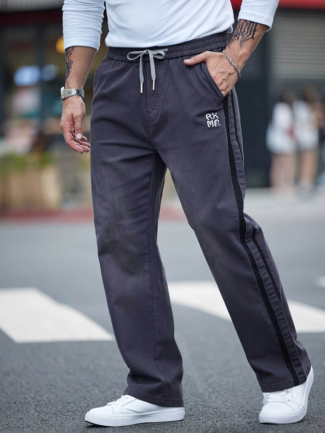 Men's cotton blend label decor straight leg pants with drawstrings for casual sports in spring and fall.