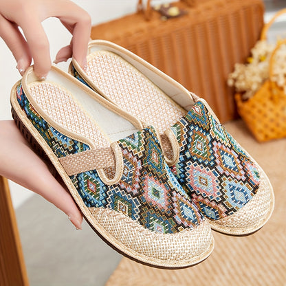 Women's printed slip-on mules with soft, lightweight soles.