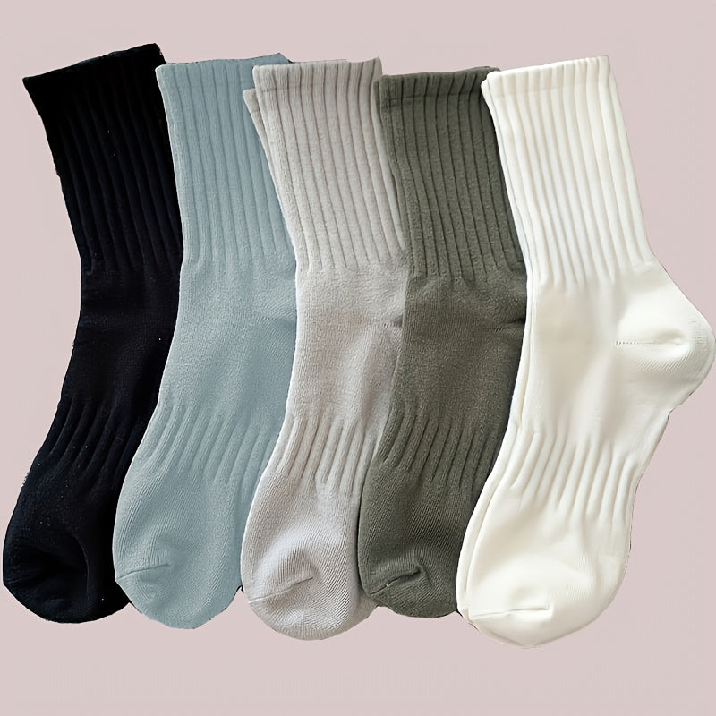 5-Pack of unisex crew socks made with breathable polyester/spandex blend in solid colors that won't fade. Features high waist and sports style, machine washable.