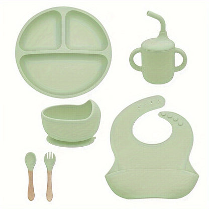 6-piece silicone feeding set with strong suction includes divided plate, wooden spoon and fork, microwave safe - great for self-feeding.