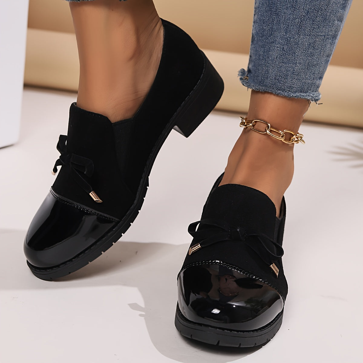 Retro bowknot loafers for women - breathable slip-on casual shoes with chunky heel, black cover upper, all-season comfort. Round toe design and decorative strap detail.