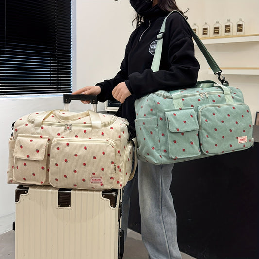 A spacious corduroy travel bag with strawberry print, wet and dry separation, shoe compartment, perfect for vacations, outings, school, crossbody use, and gym.