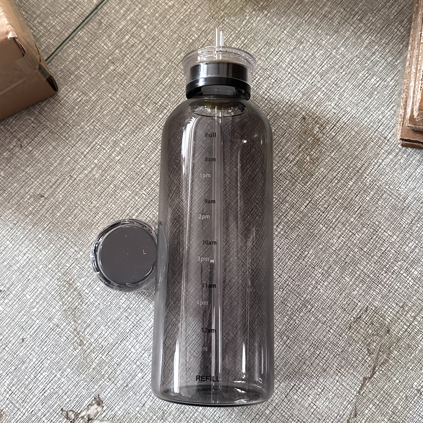 Leakproof glass water bottle with time marker, ideal gift for any occasion.