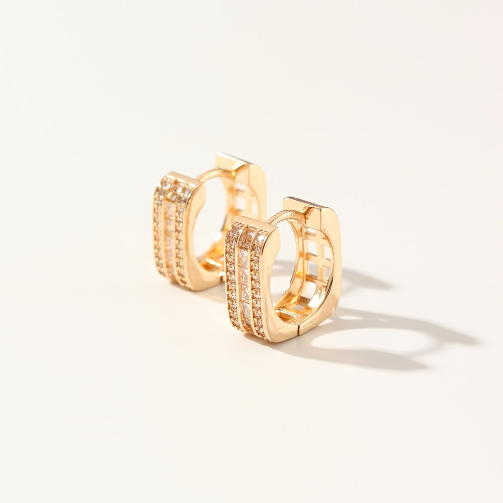 A stylish pair of MKOPSZ hoop earrings, featuring classic design and crafted with copper and synthetic zirconia. These earrings, representing the April birthstone, are perfect for both daily wear and special occasions. Inspired by a campus holiday theme