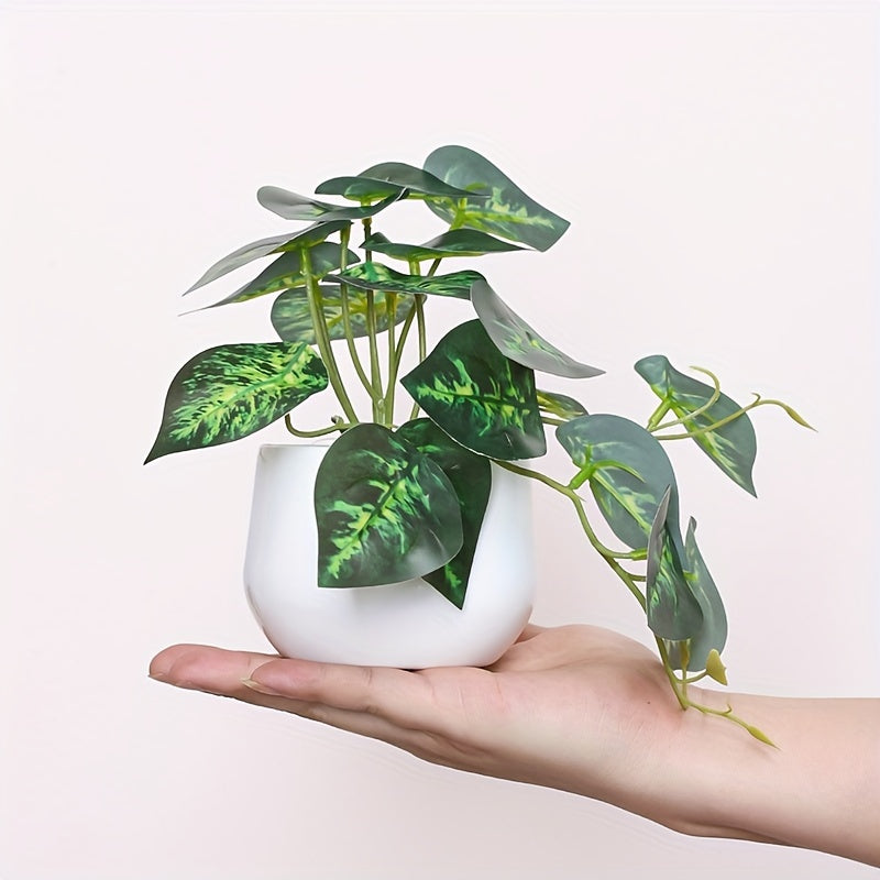 Artificial green leaf plant for home, office, or shelves décor.