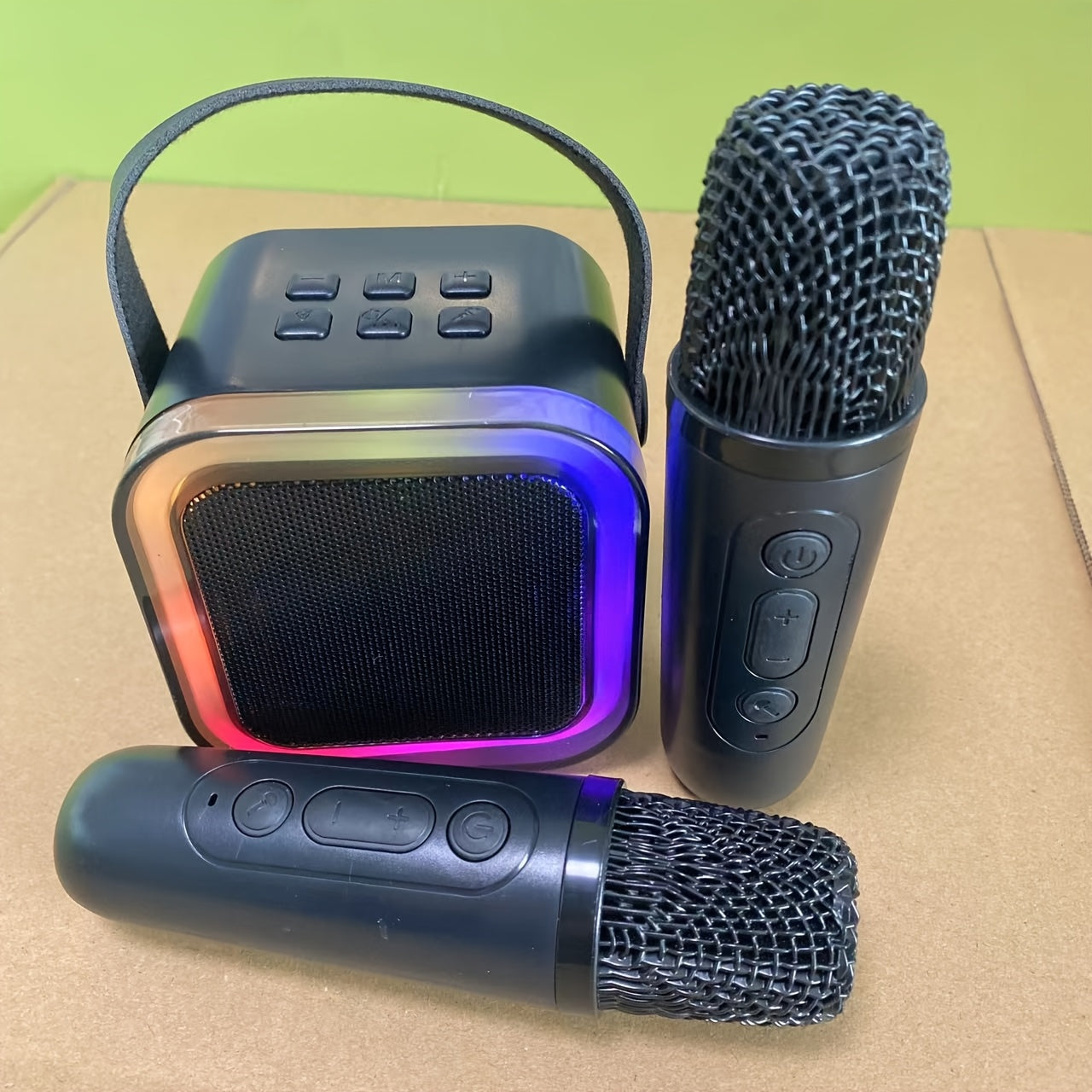 Portable mini karaoke machine with 2 wireless mics ideal for youngsters' birthday parties and family fun, USB rechargeable speaker.