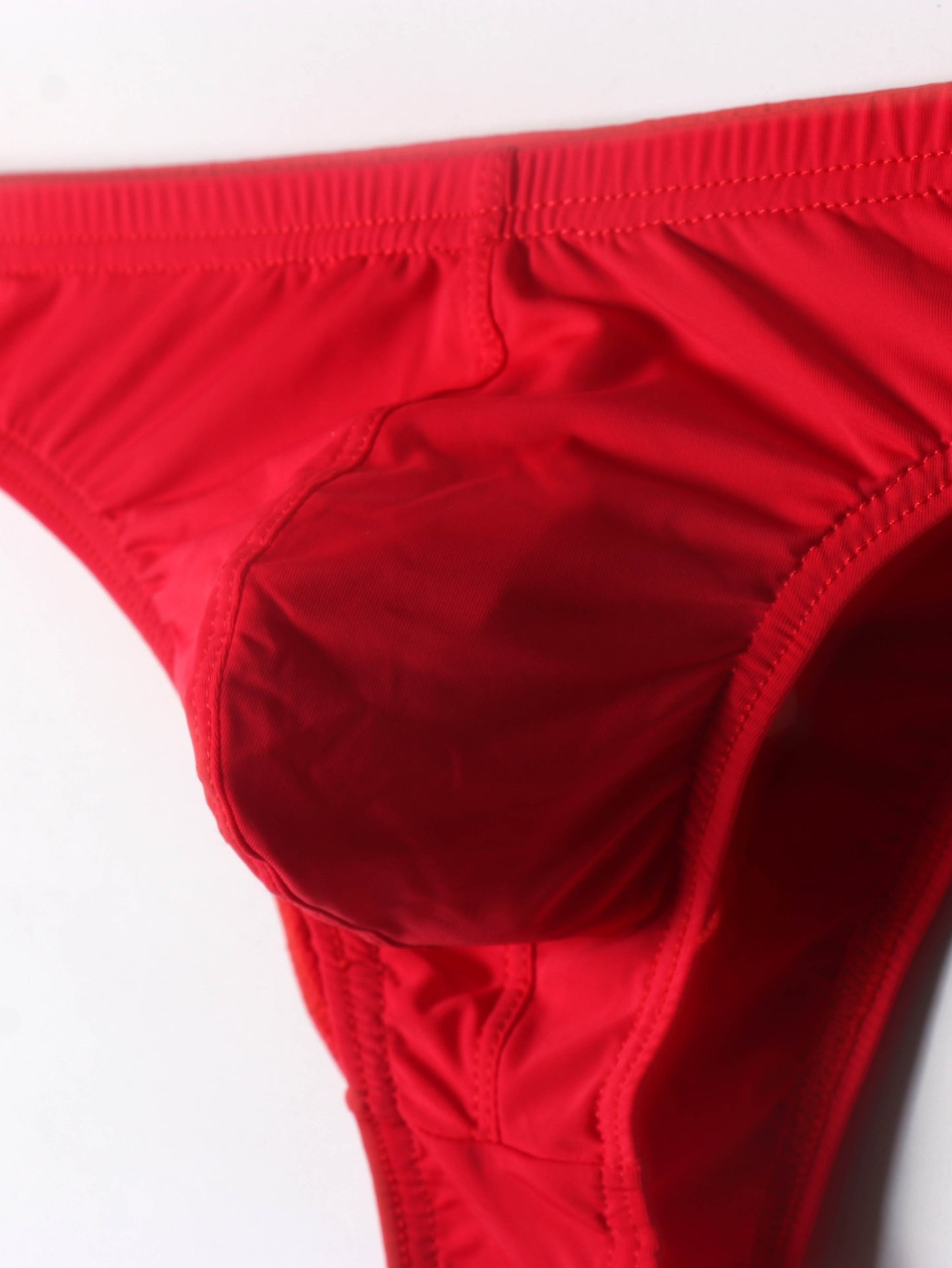 Low-rise breathable triangle underwear for young men with U-shaped pouch.