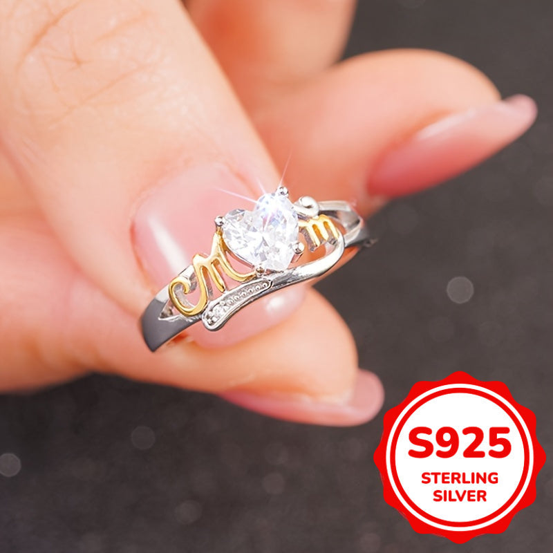 Heart-shaped zirconia ring in sterling silver with MOM lettering, featuring a 4-prong setting in a vintage sexy style. Perfect for all seasons, this ring makes a great Mother's Day gift. It also includes a synthetic gemstone representing April's