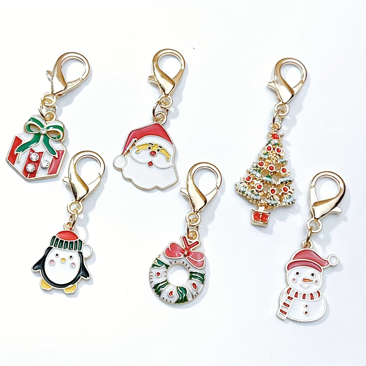 Six Christmas keychain charms made of zinc alloy with festive keyrings. These non-plated metal bag pendants are simple in style and perfect as holiday gifts for friends.