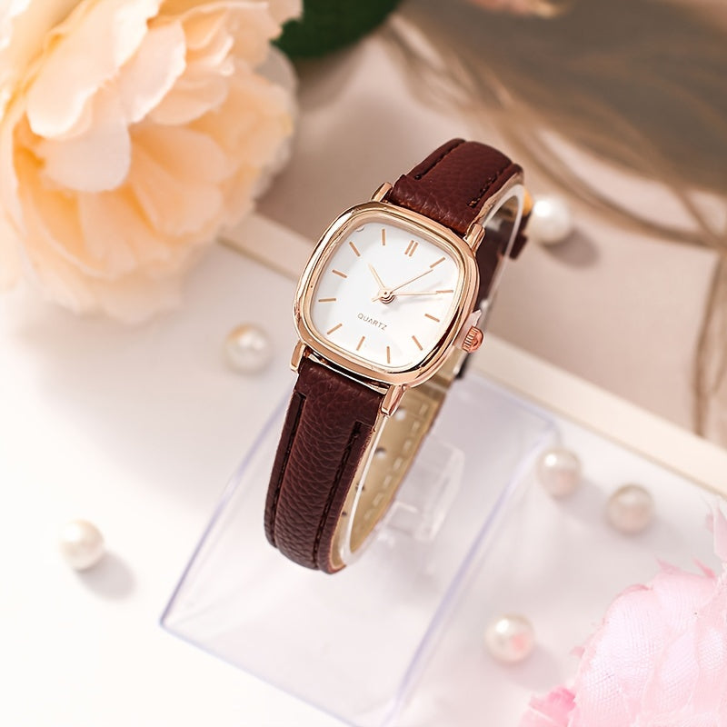 Elegant women's wrist watch with synthetic leather band, quartz movement, rectangular dial, pointer display, electronic drive, button battery powered.