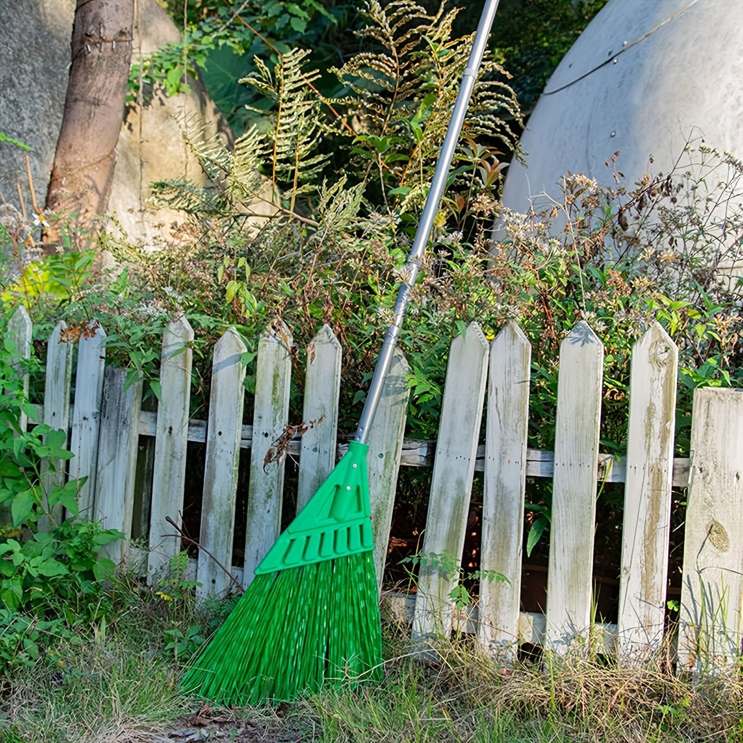 Long-handled outdoor commercial angle broom ideal for courtyards and hard floors.