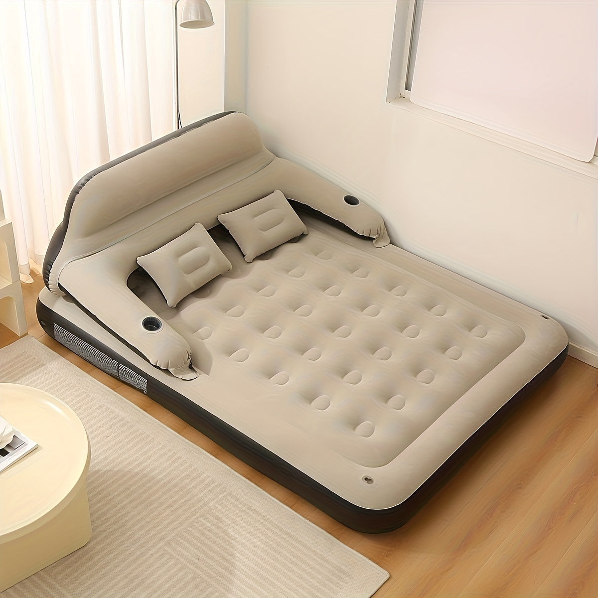 Air mattress with headboard, blow-up sofa bed, for indoor and outdoor use.