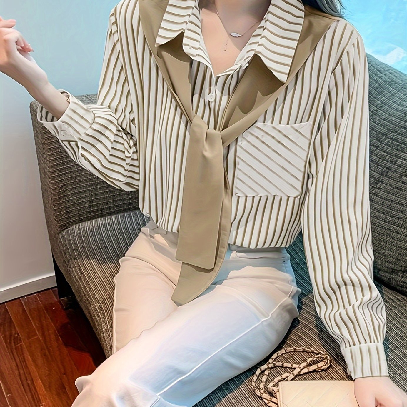 Elegant striped lace-up shirt with long sleeves and single breasted placket made of polyester, perfect for adults in spring/fall. Features a square neck.