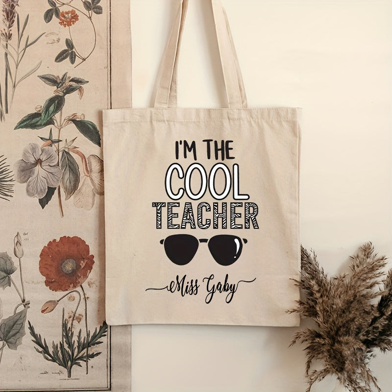 Customized Teacher Shoulder Bag with "I'm The Cool Teacher" Pattern, featuring a personalized name. This stylish canvas shopping bag is perfect for female teachers and makes a great gift for any teacher who loves aesthetic school bags.