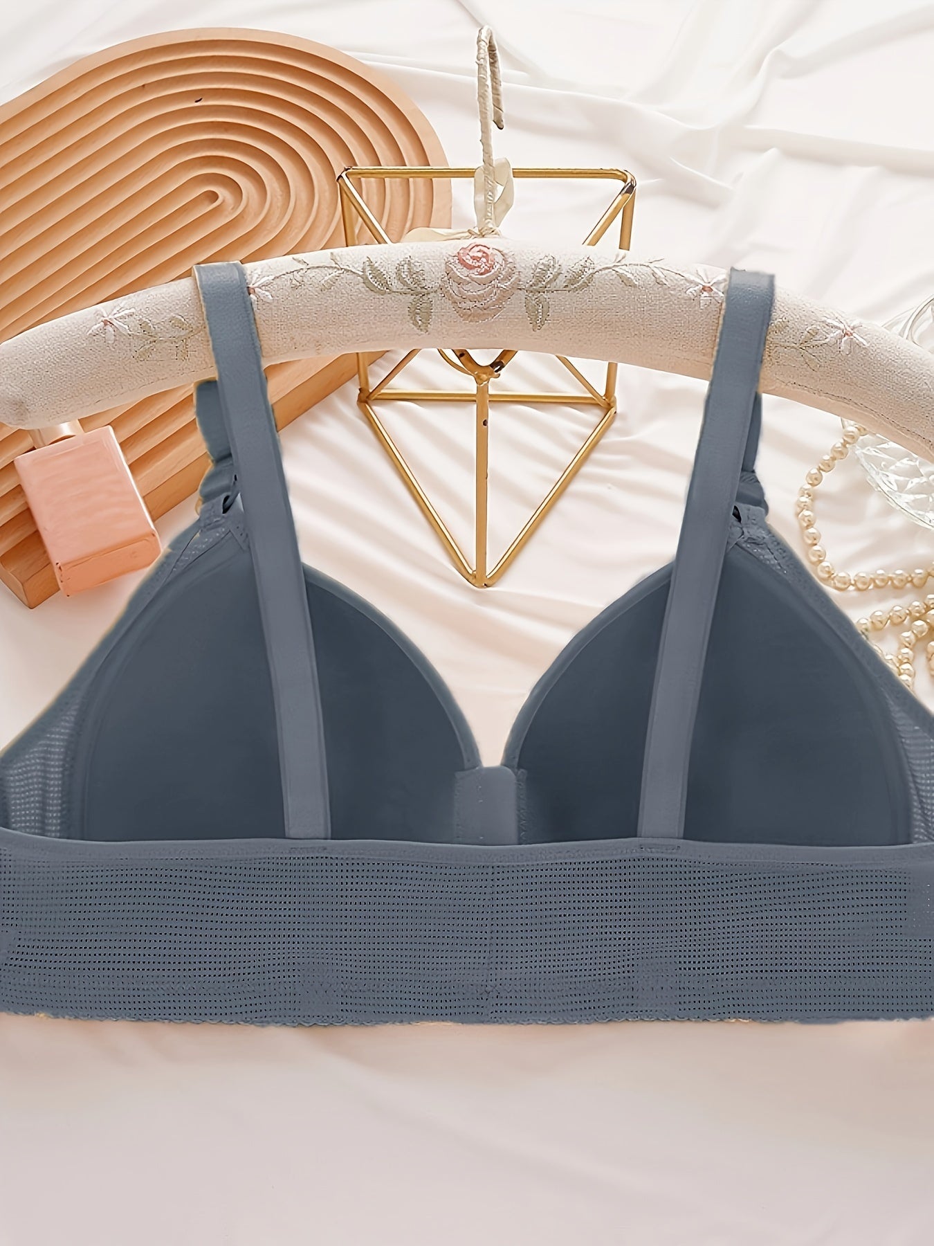 Women's seamless wireless bralette made of breathable polyester knit fabric. Offers comfortable support and stretch for all seasons.