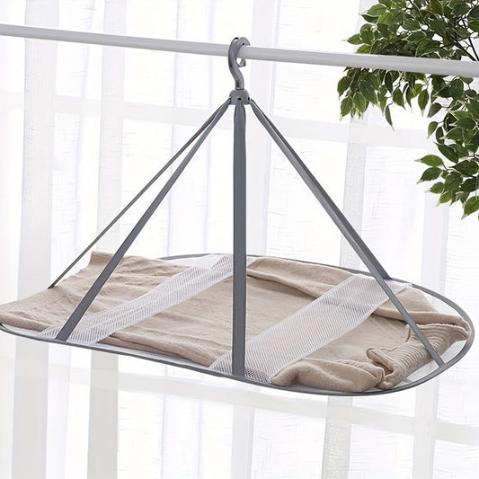 Three-story grey clothes dryer with mesh netting, perfect for drying large items and providing wind protection.