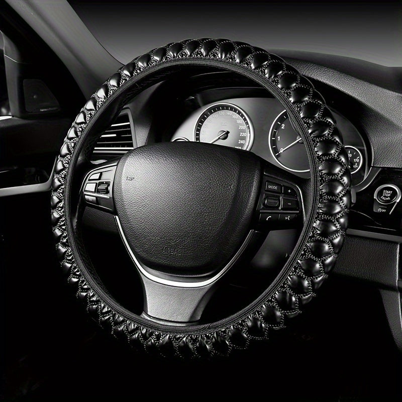 Luxurious embroidered faux leather steering wheel covers with anti-slip grip, universal fit. Comfortable and durable accessory for your vehicle.