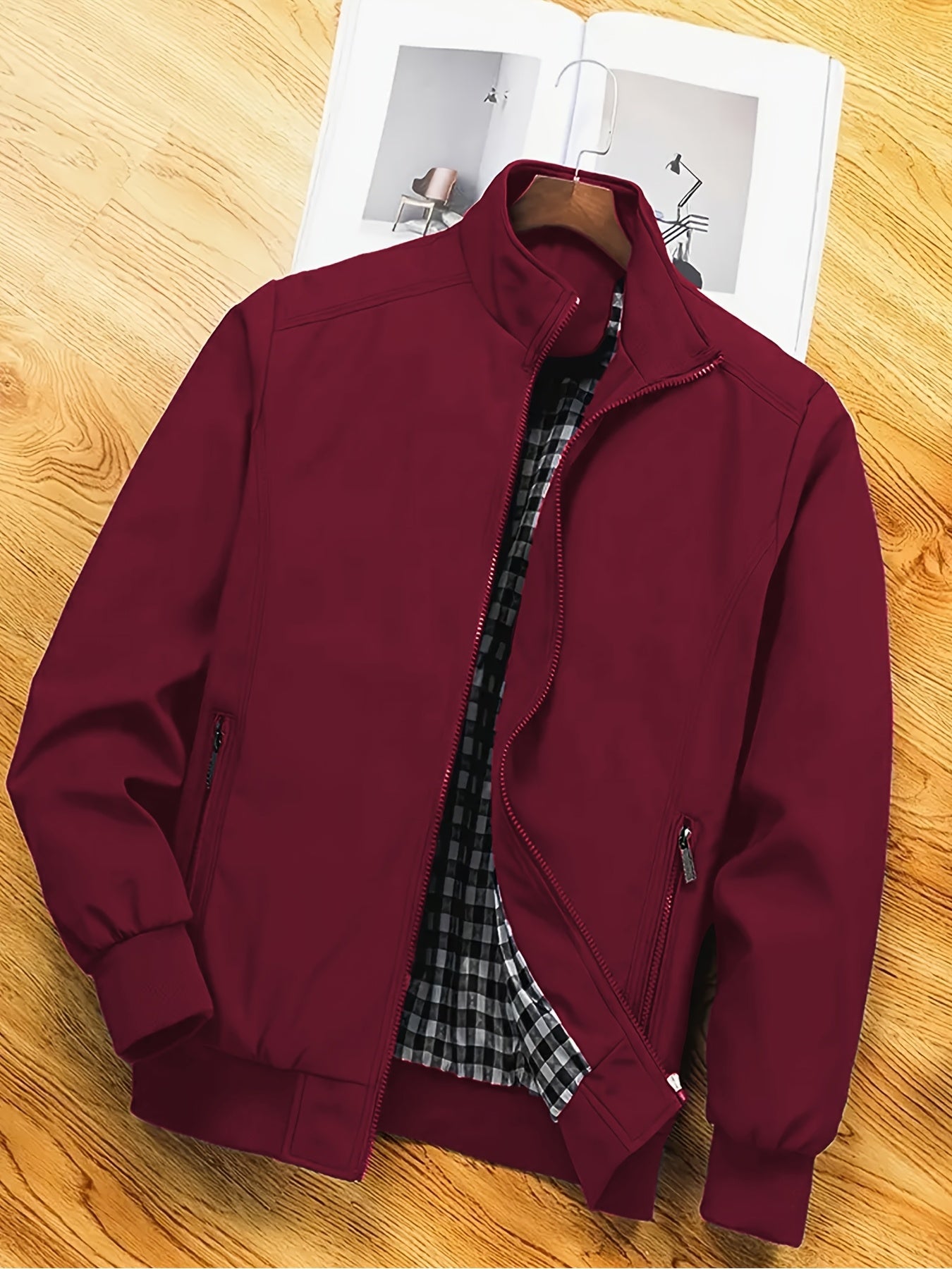 Men's casual spring/autumn polyester jacket with stand collar, zipper pockets, and solid long sleeves for outdoor and workwear.