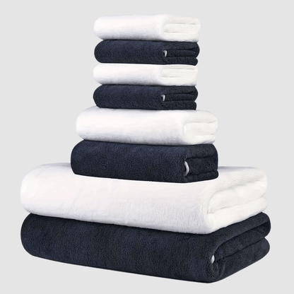 This 8-piece set includes 2 bath towels (68.58 X 139.7 cm), 2 towels (34.8 X 74.93 cm), and 4 square towels (29.97 X 29.97 cm). They are super soft, quick-drying, absorbent, and