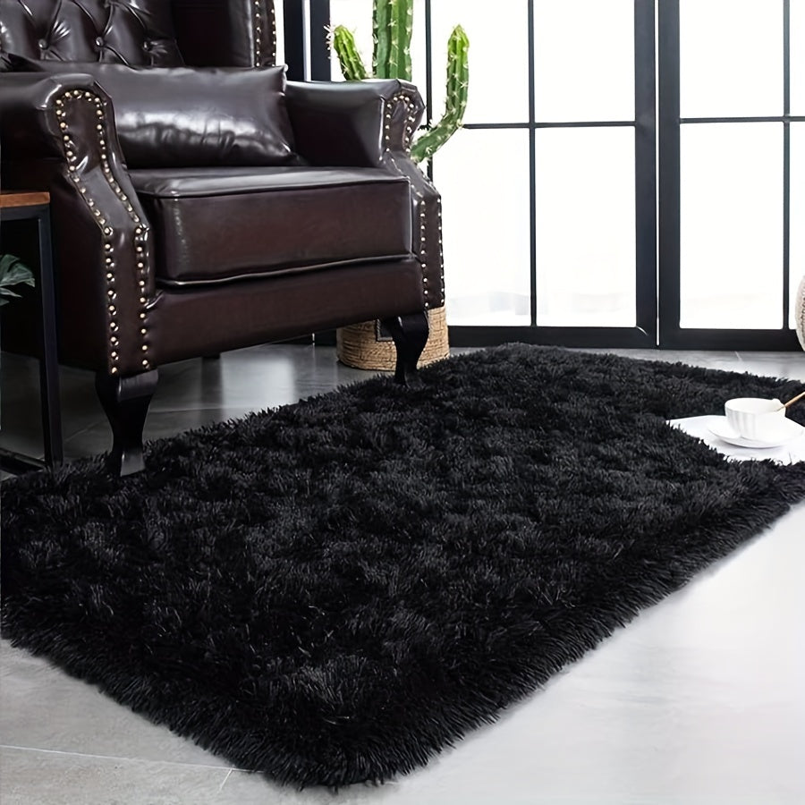 Soft and fluffy polyester shag area rug suitable for living room and bedroom. This plush floor mat is easy to clean but must be dry cleaned only. Ideal for indoor use, measuring 60 x 100cm.