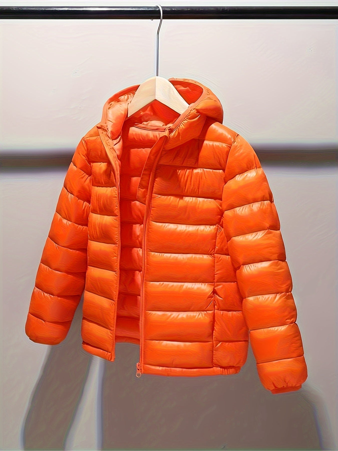 Kids' polyester puffer jacket with hood and zipper, ideal for fall/winter.