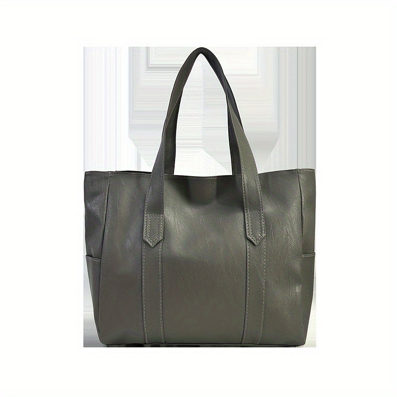 Chic black tote bag for women with foldable design, zip closure, multiple compartments, and polyester lining.