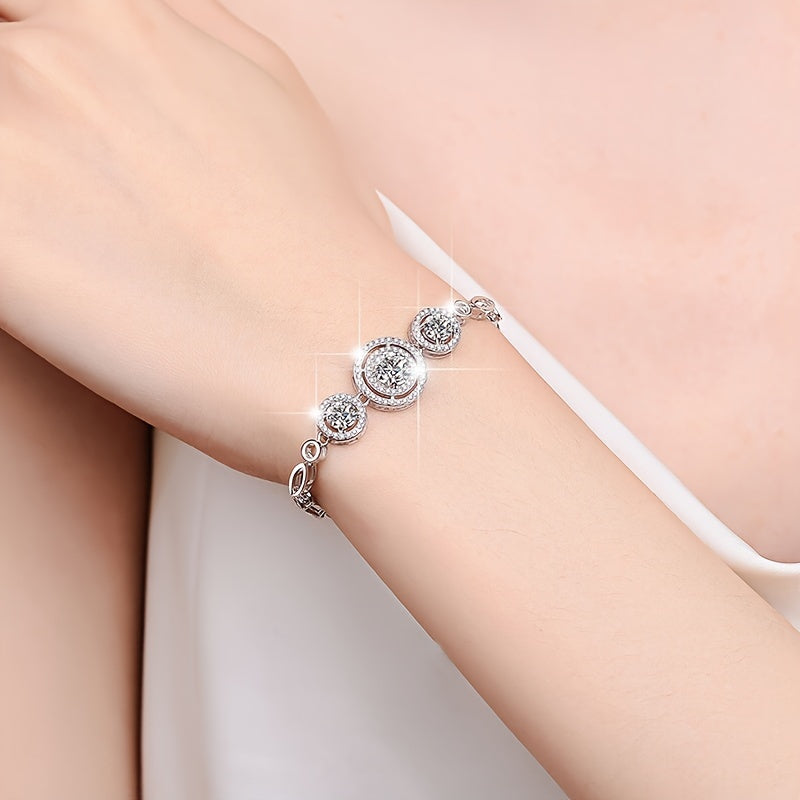 This new 925 Sterling Silver Moissanite Bracelet features a stunning 2 Carat Round Bag design, exuding a fresh and versatile temperament. It is the perfect piece of jewelry for women, making it an ideal anniversary gift. This bracelet is suitable for