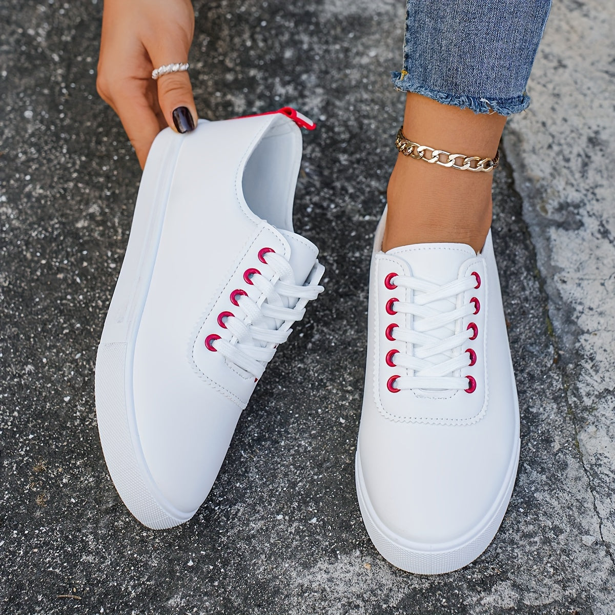 Versatile women's white sneakers with classic design, lace-up closure, round toe, and rubber sole for all seasons. Made with faux leather upper and comfortable fabric lining.