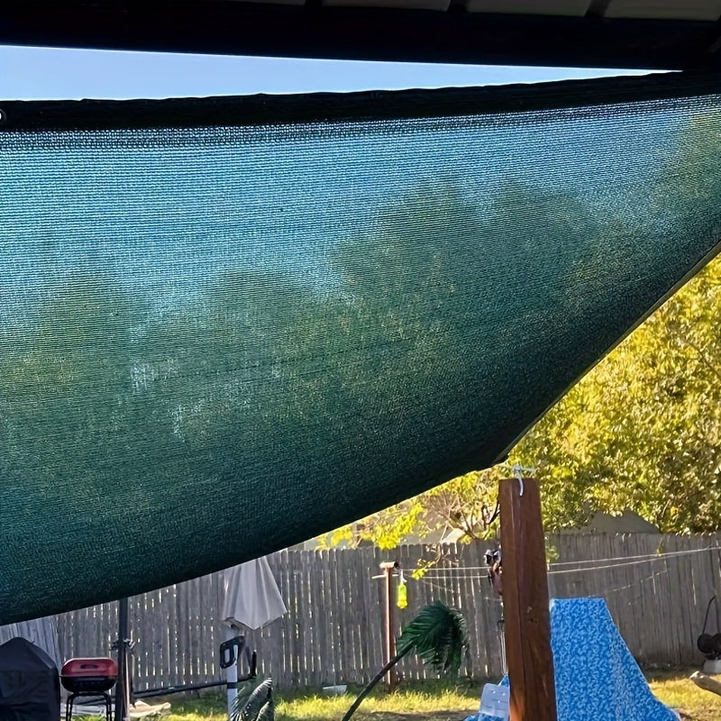 Dark green polyethylene sunshade net for outdoor garden with UV protection and breathability.