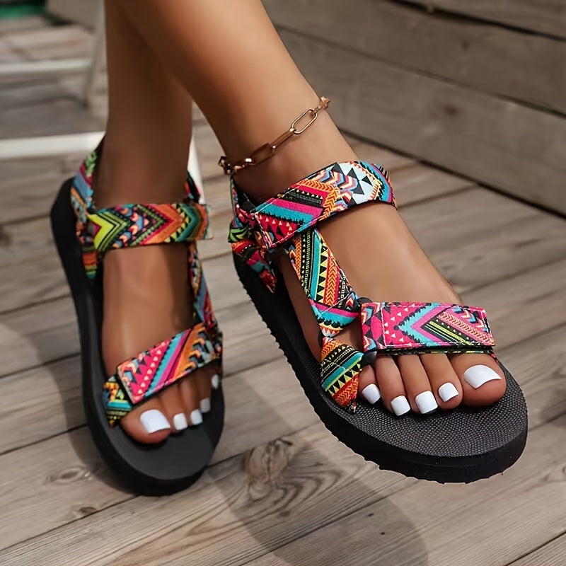 Flat sandals with tribal pattern, open toe and lightweight design for casual summer wear.