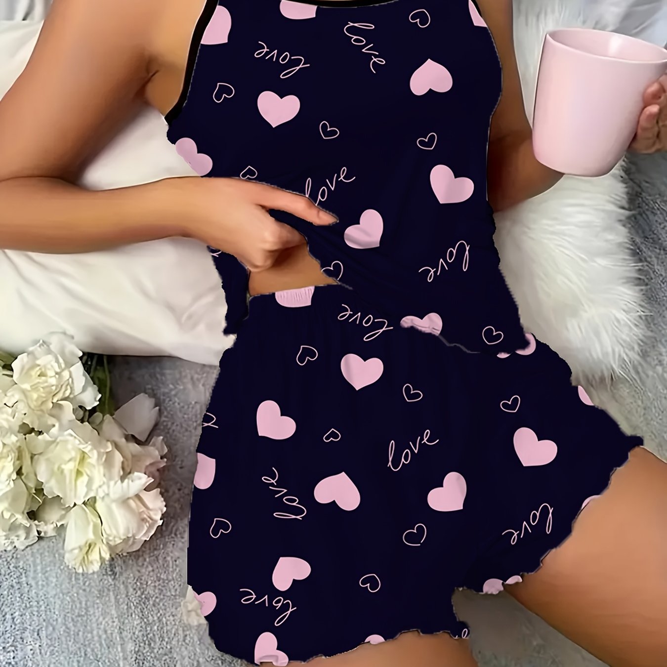 Women's sexy polyester pajama set with love heart print spaghetti strap shorts, perfect for all seasons.