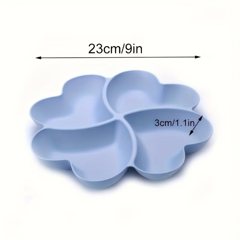 Heart-shaped party snack tray with 4 compartments, perfect for serving nuts, candy, fruit, and other snacks. Made of reusable plastic in blue, green, beige, and pink colors.