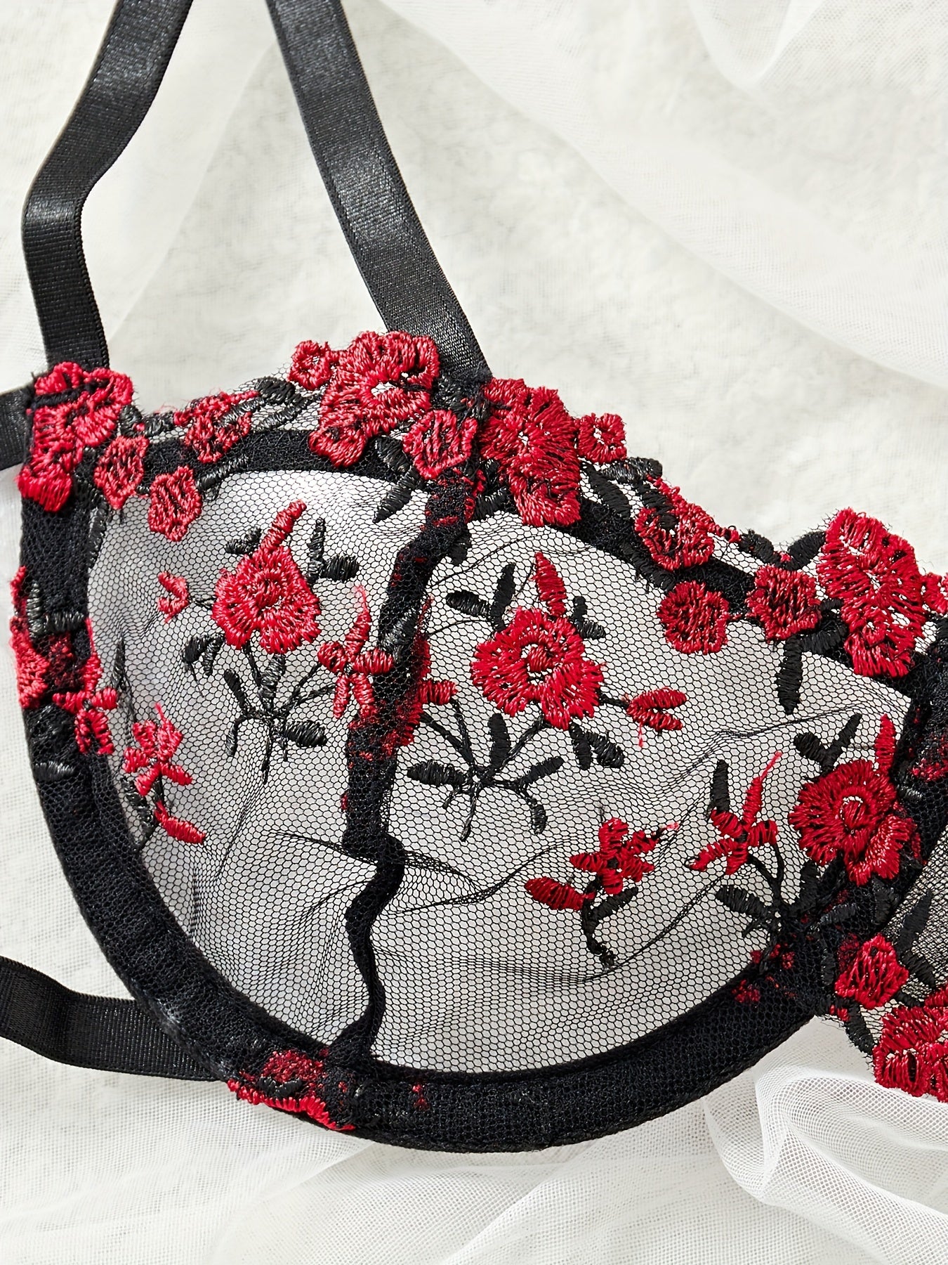 Floral embroidery lingerie set with unlined cut out bra and mesh thong, for a sexy look.