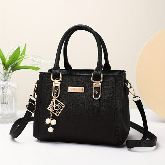 Large black tote with adjustable shoulder strap, minimalist design, ideal for daily use or as a Valentine's Day gift.