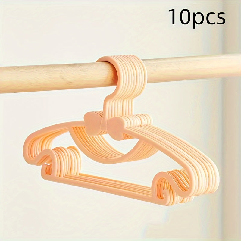 10-piece set of sturdy plastic hangers for kids' clothing - features anti-slip design and space-saving storage solution for children's wardrobes and dorm rooms.