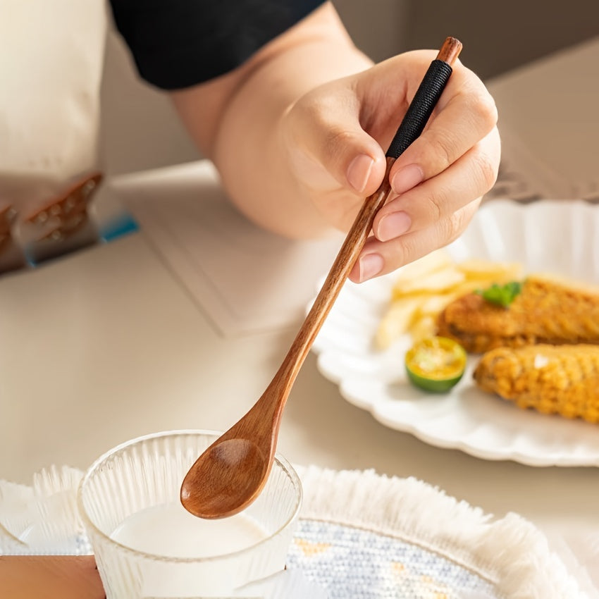 Creative long handle Japanese-style honey stirring spoon with twisted round handle, made from small wooden spoon.