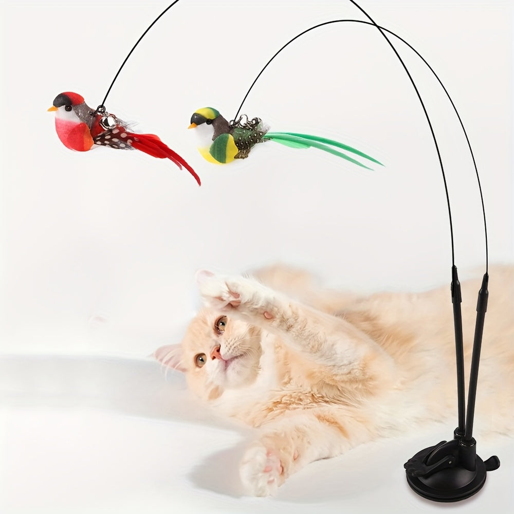 Cat toy set with cartoon pattern, feathers, bell, and adhesive base; no batteries required.