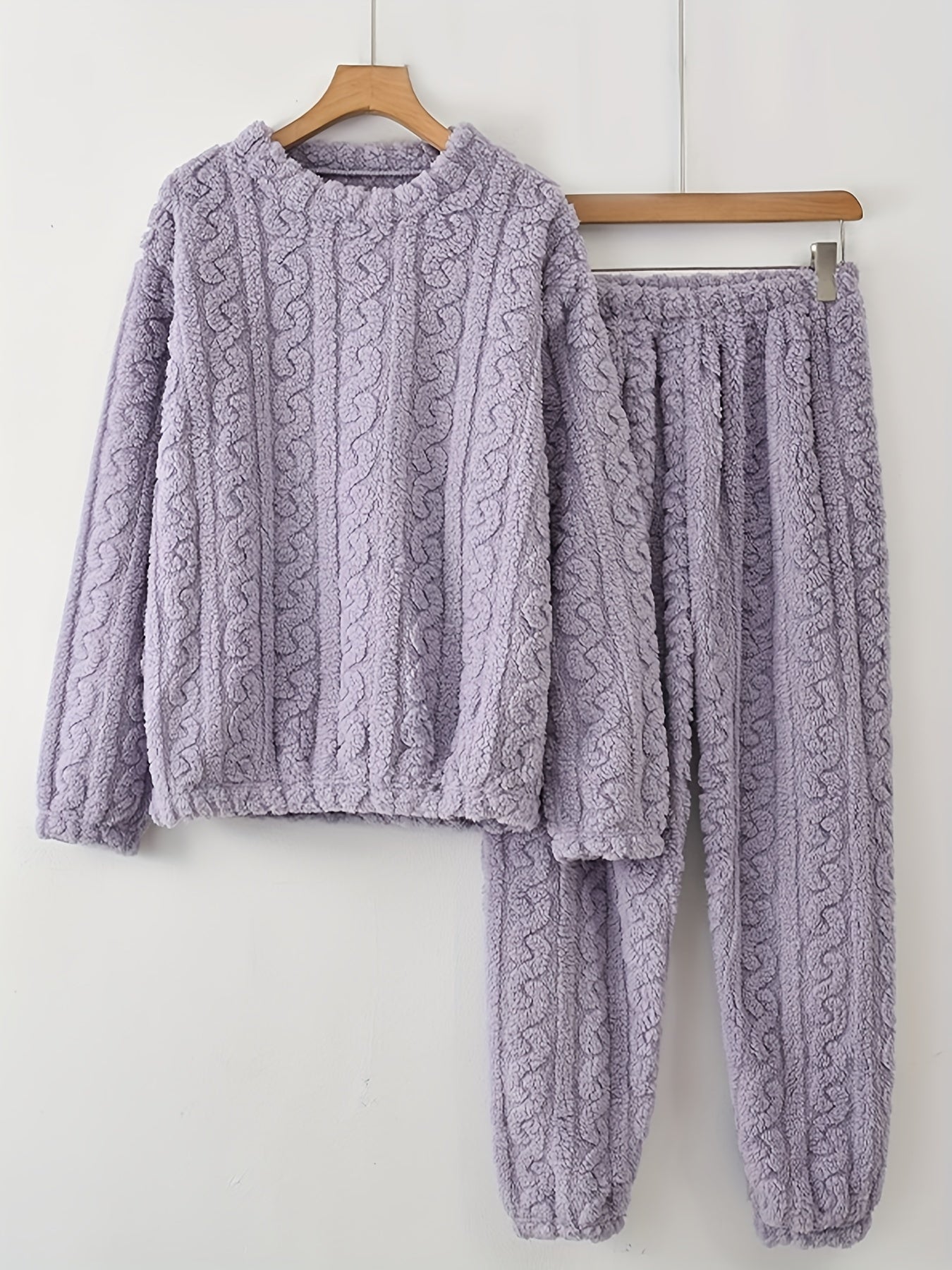 Women's cozy lounge set with fleece jacquard fabric, featuring a crew neck top and joggers. Ideal for lounging and sleeping.