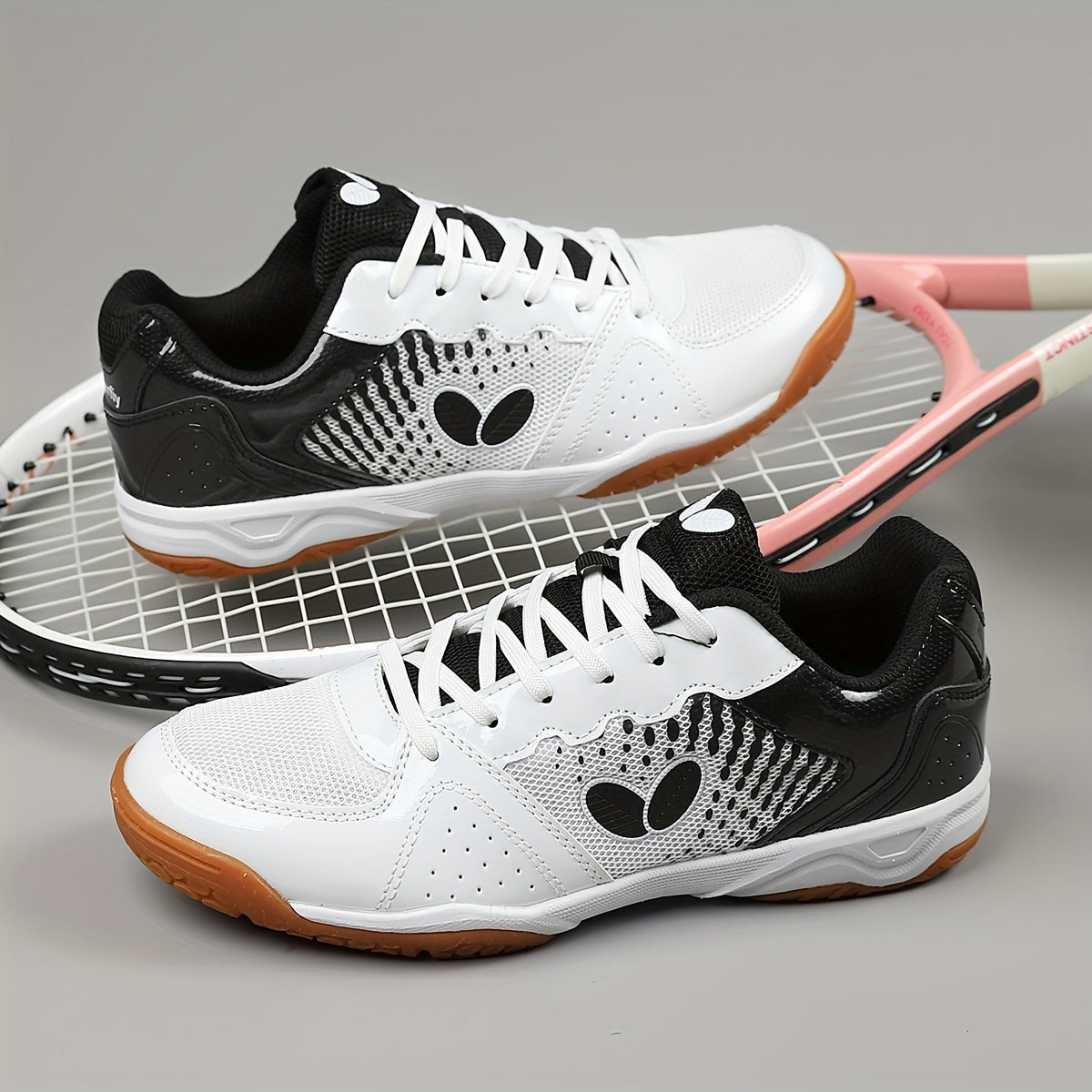 Breathable badminton and table tennis shoes in blue with orange accents, featuring a durable sole and lace-up design for all-season athletic wear.