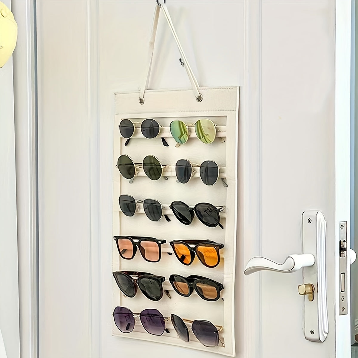 Organize your sunglasses with this hanging wall organizer featuring 12 slots made of felt. Keep your glasses dust-proof and easily accessible with this storage display pocket wall stand holder.