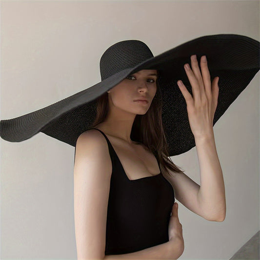 Foldable straw sun hat with extra wide brim and UV protection, perfect for beach vacations, travel, and photography. Black textured design.