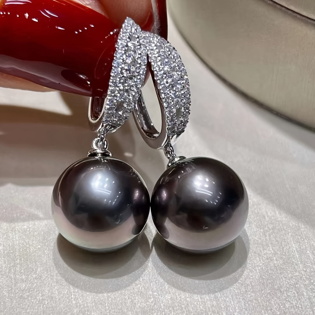 These stunning imitation pearl earrings are adorned with delicate micro-paved zirconia, adding an elegant touch. Ideal for weddings, parties, anniversaries, or as a thoughtful gift for any occasion.