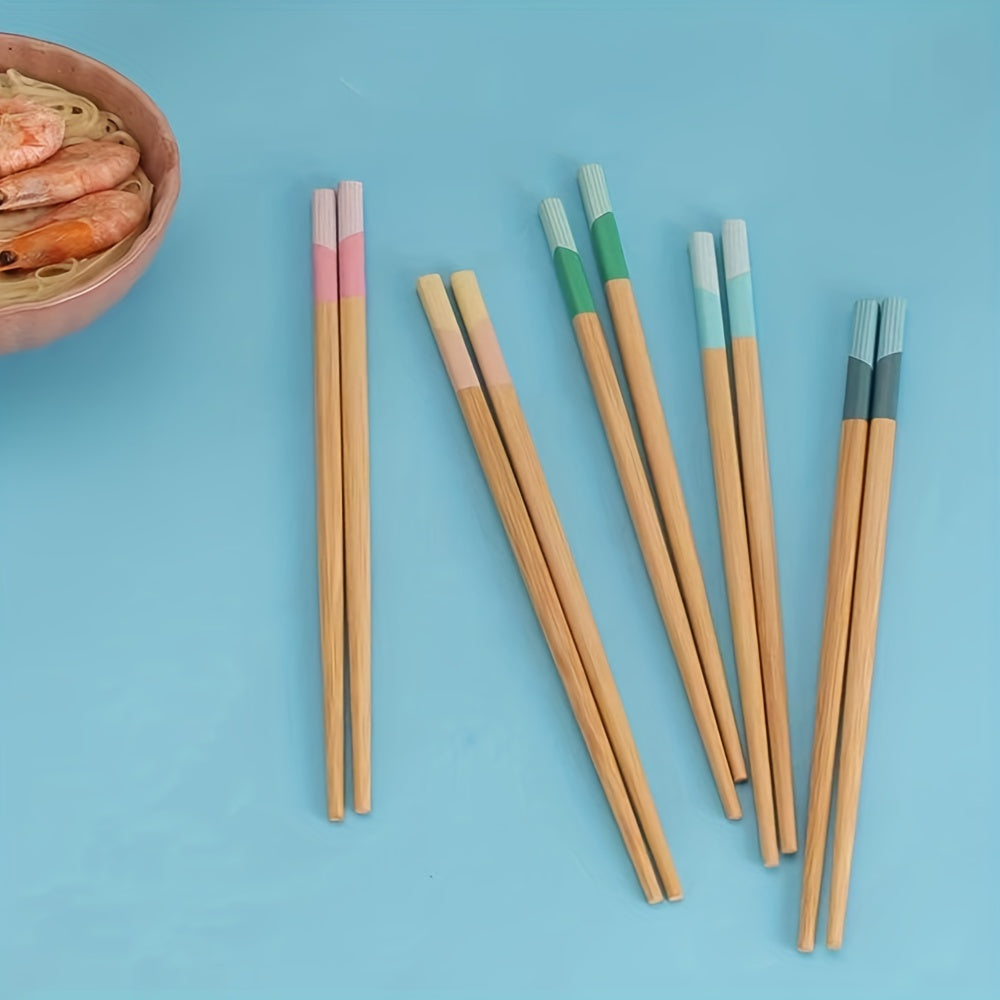 5 pairs of bamboo chopsticks that are antibacterial, anti-mold, anti-slip, carbonized, and high-temperature resistant. They are also reusable, lightweight, dishwasher safe kitchen supplies.