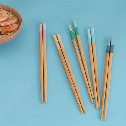 5 pairs of bamboo chopsticks that are antibacterial, anti-mold, anti-slip, carbonized, and high-temperature resistant. They are also reusable, lightweight, dishwasher safe kitchen supplies.