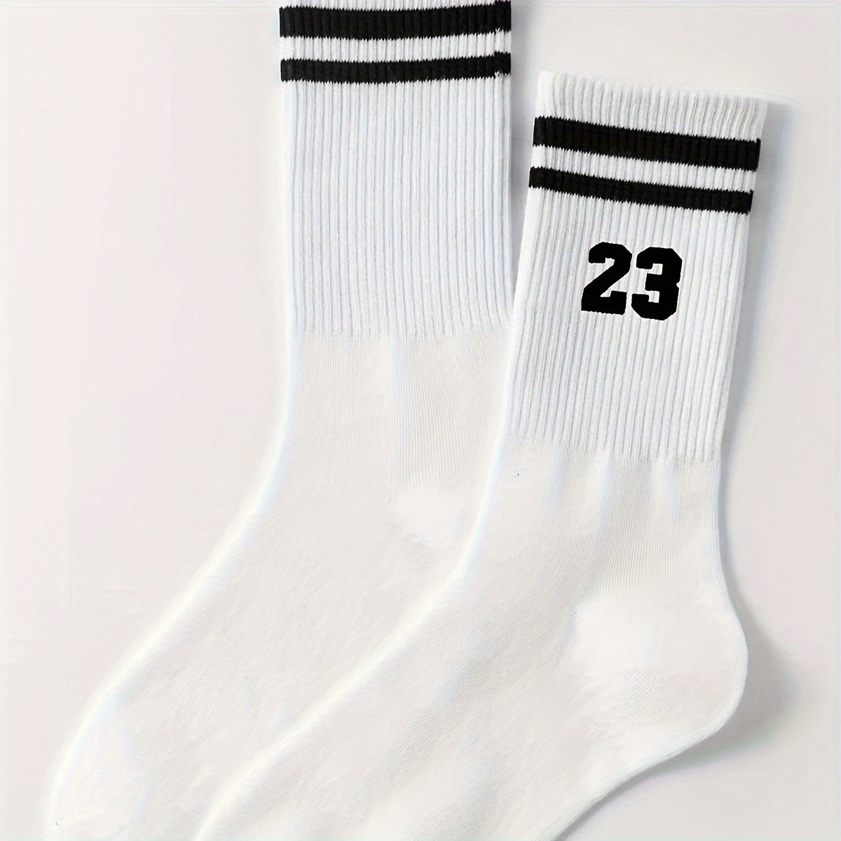 Men's athletic mid-calf socks with striped pattern featuring number 23. Made of 95% polyester and 5% spandex. Hand wash only.