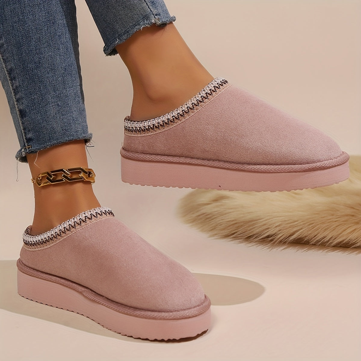 Warm and cozy women's winter slippers with plush lining and anti-slip sole.