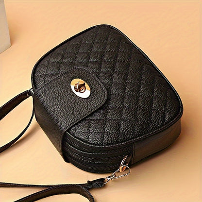 Women's black quilted crossbody bag with adjustable strap, zipper closure, tassel embellishment, and polyester lining.