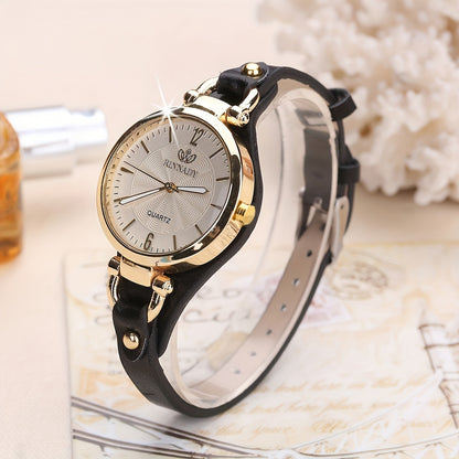 1 elegant women's quartz watch with black faux leather strap and golden-tone accents - fashionable analog display, battery operated, perfect for everyday and special occasions.