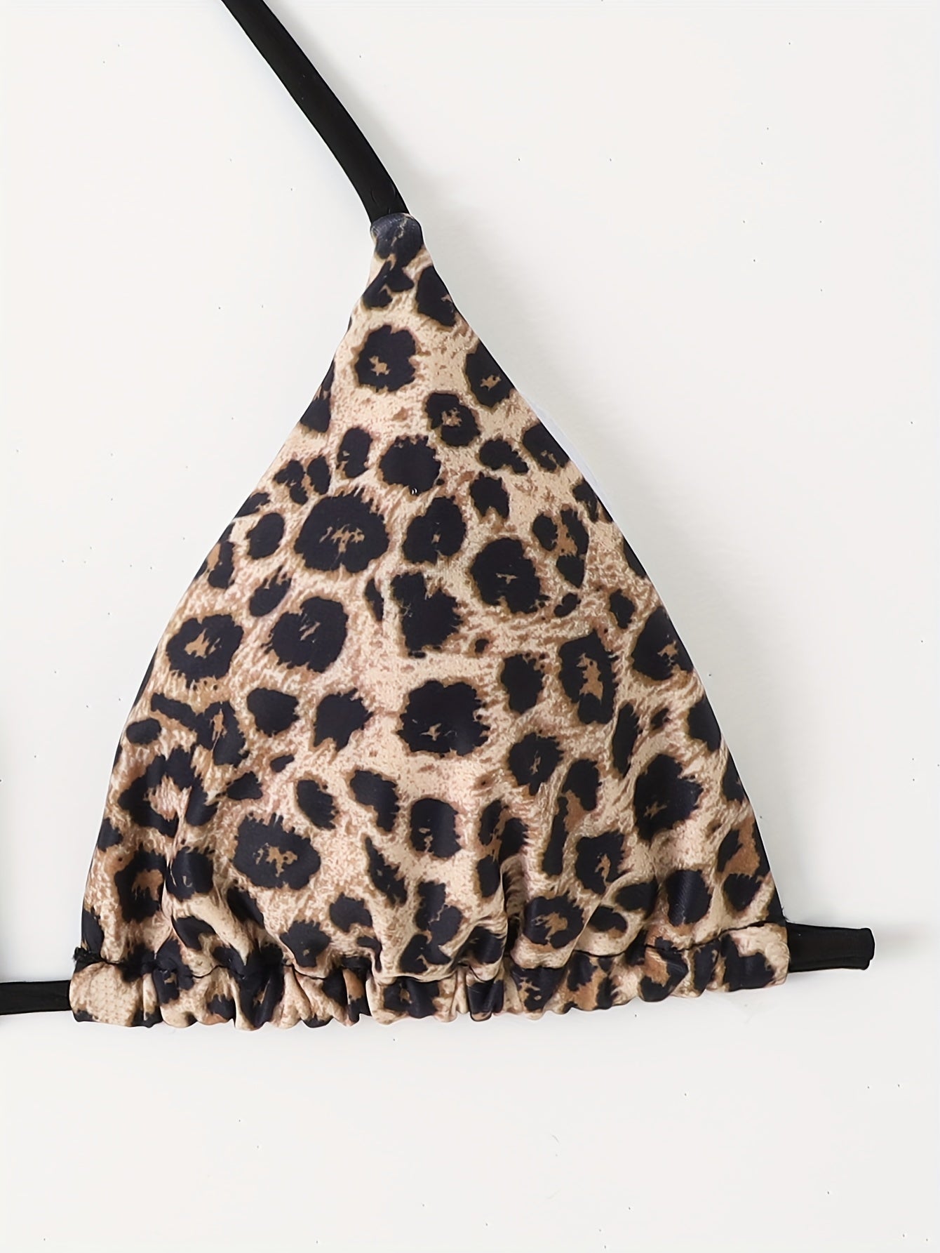 Two-tone triangle bikini top with leopard print and solid black color, adjustable tie back for poolside or beach fashion.